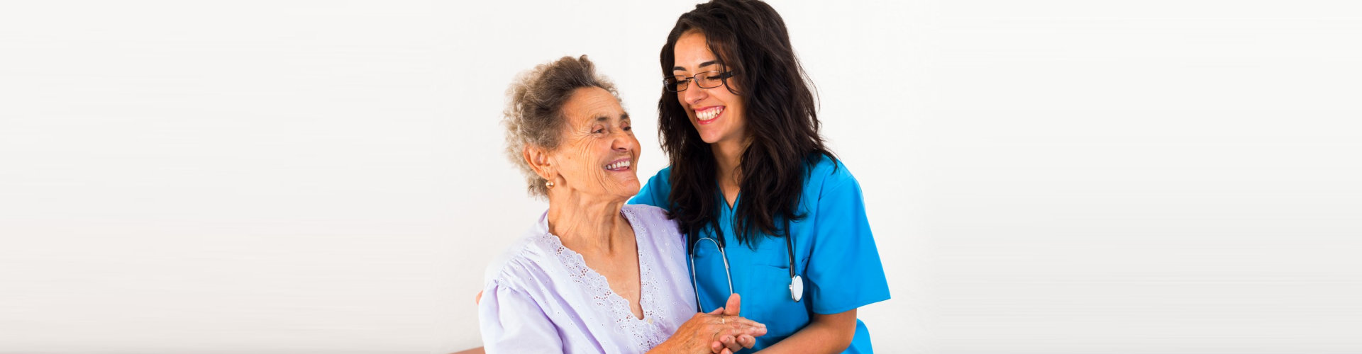 nurse and senior woman are laughing