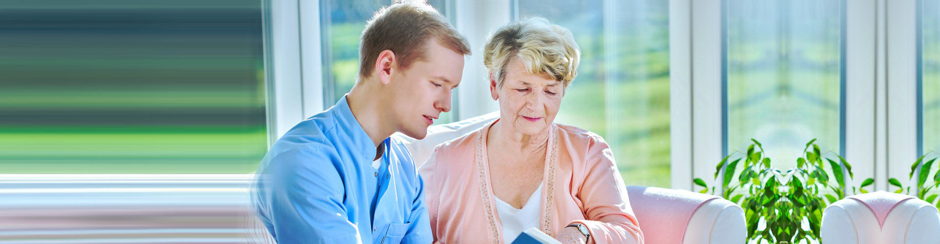 male nurse and senior woman having a conversation