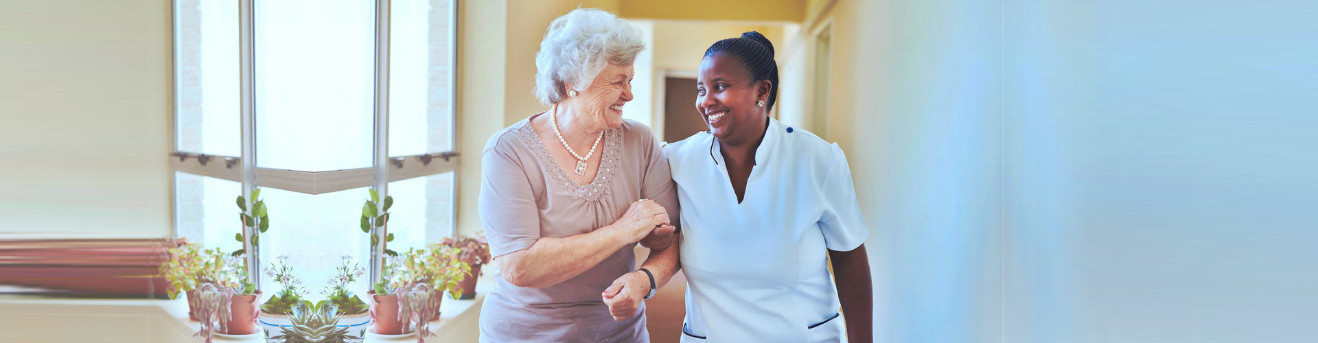 caregiver and senior woman having a conversation